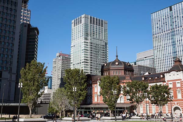 exterior of the hotel surrounded by tall buildings located right beside tokyo station