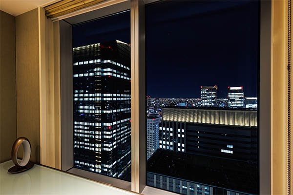 an outside view from the room looking down the city at night