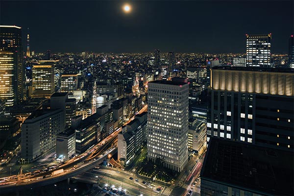 an outside view from the room looking down the city at night