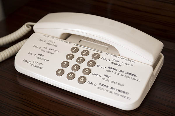 hotel in-house phone indicating number assist
